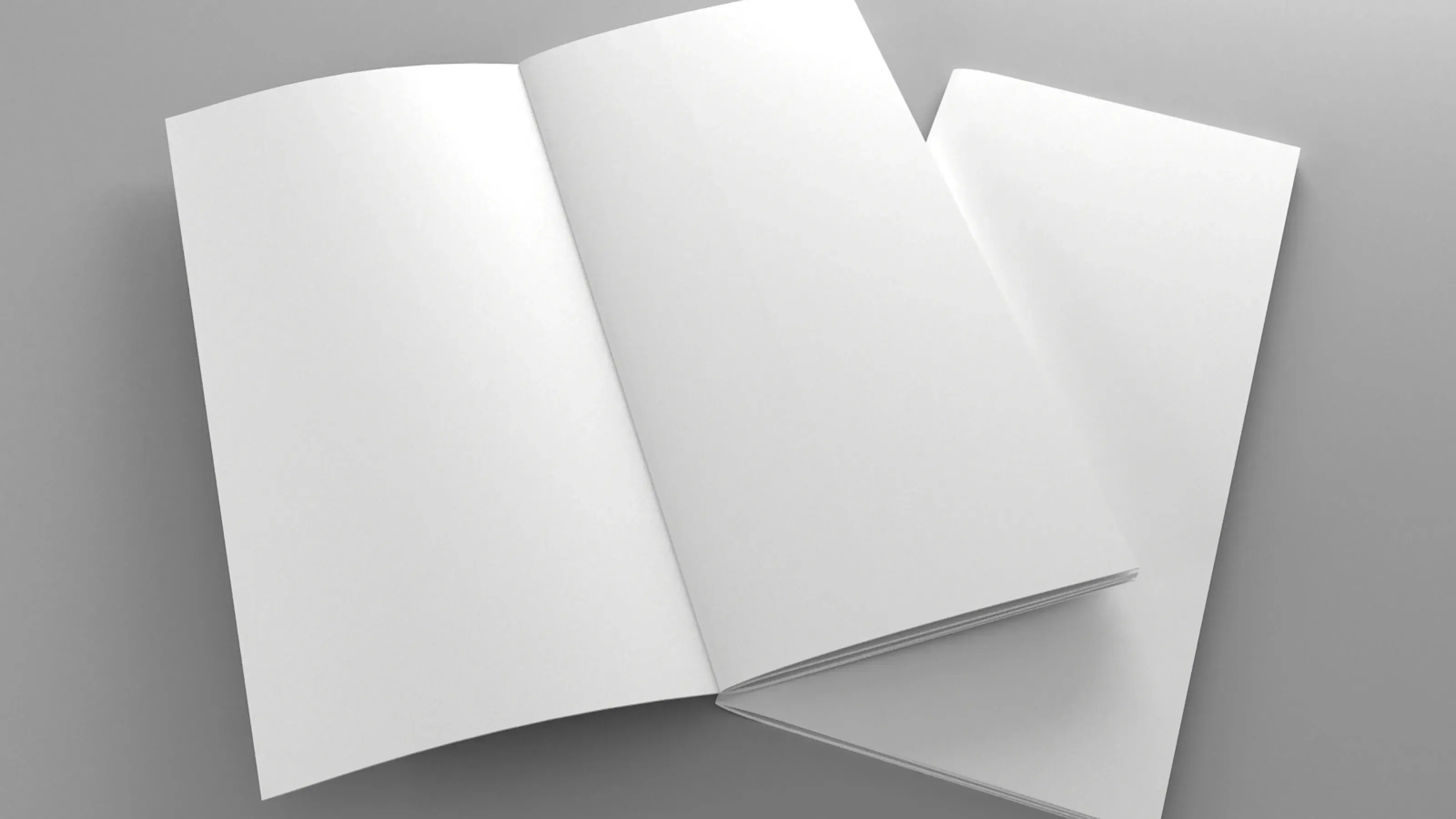 A printed funeral order of service booklet with a photograph on the cover resting beside white flowers